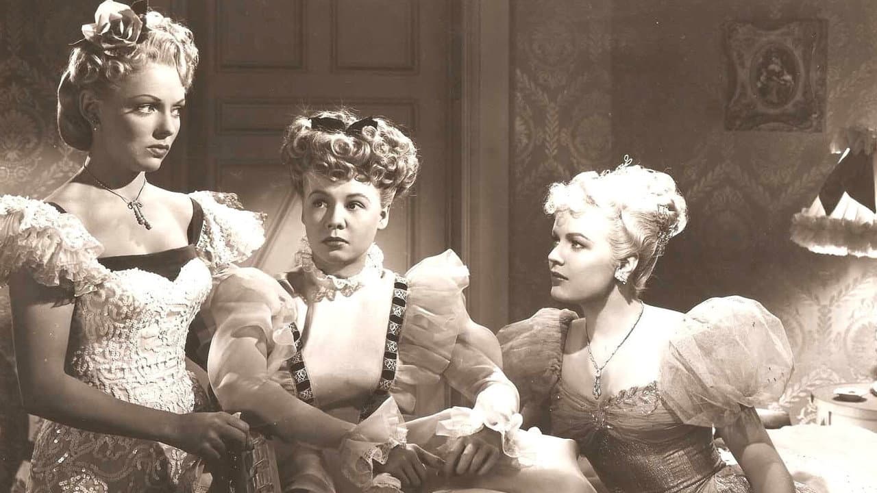 Tres jovencitas vestidas de azul